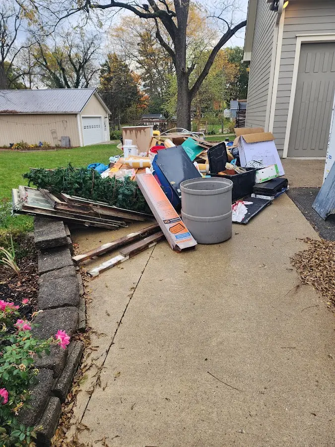 Dumpster being loaded with debris for 3 Yard Dumpster Rental in Lake Holm
